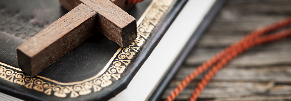 Cross on Bible